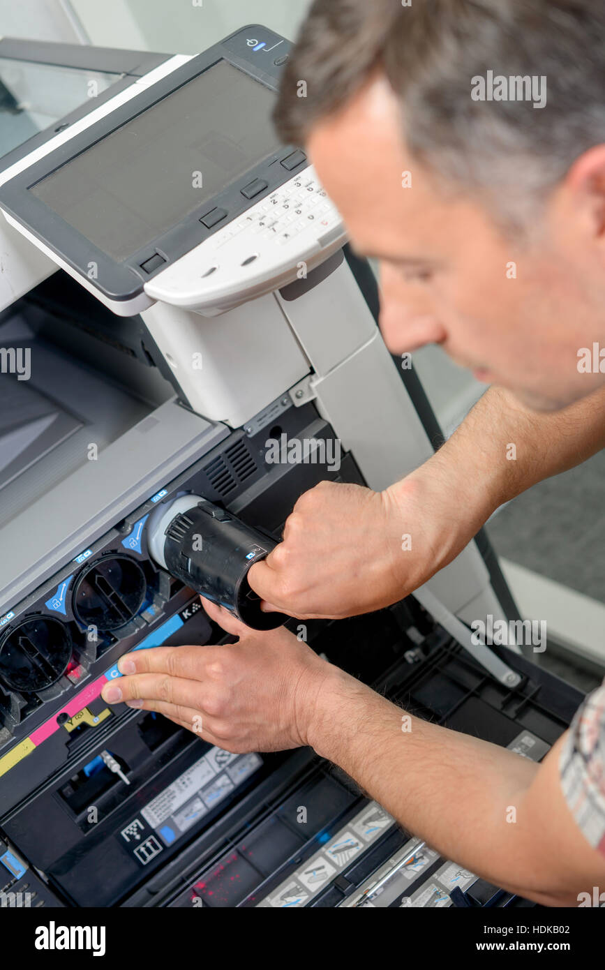 Replacin the printer ink Stock Photo - Alamy