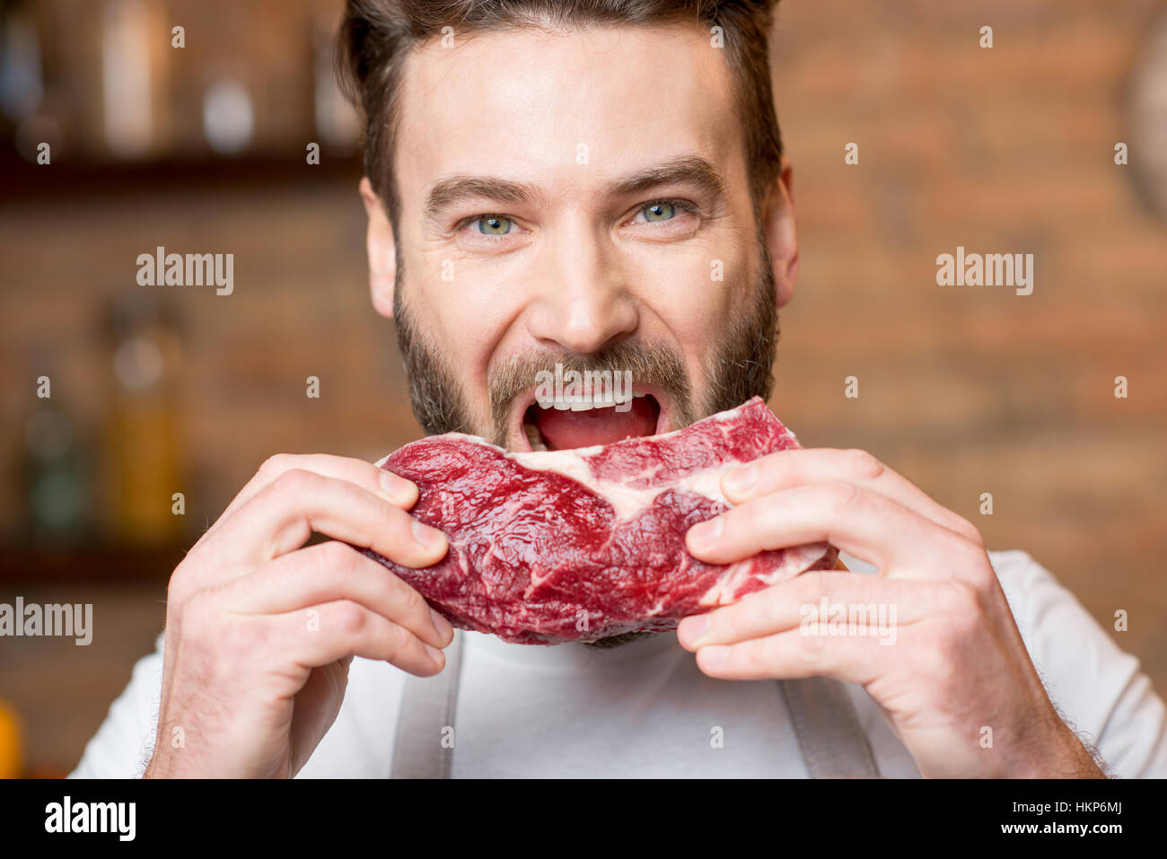 Man with meat Stock Photo Alamy