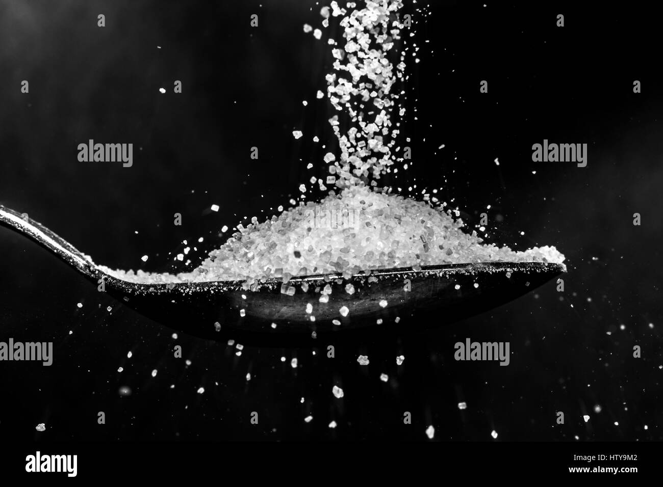 Sugar on spoon Stock Photo Alamy