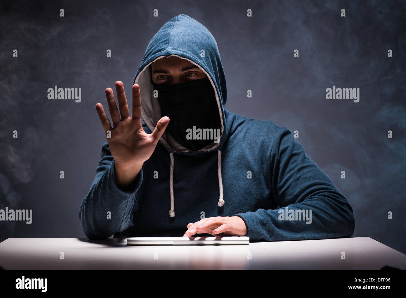 Computer hacker working in dark room Stock Photo Alamy