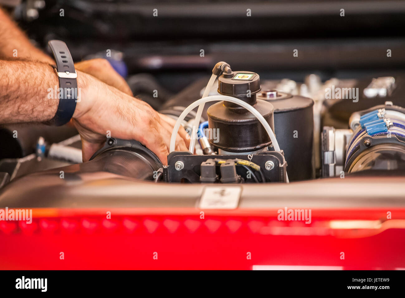 Workman checking engine Stock Photo Alamy