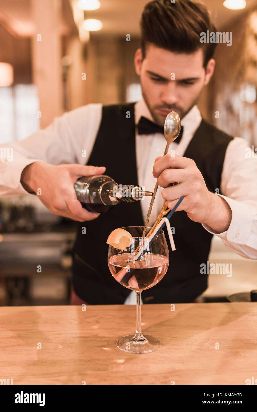 Bartender making cocktail Stock Photo Alamy