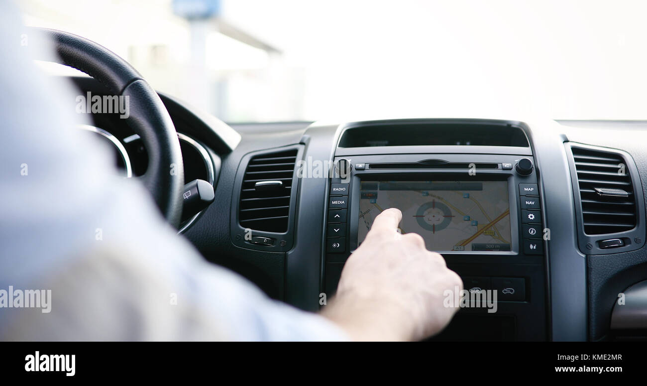 Man using navigation system while driving car Stock Photo Alamy