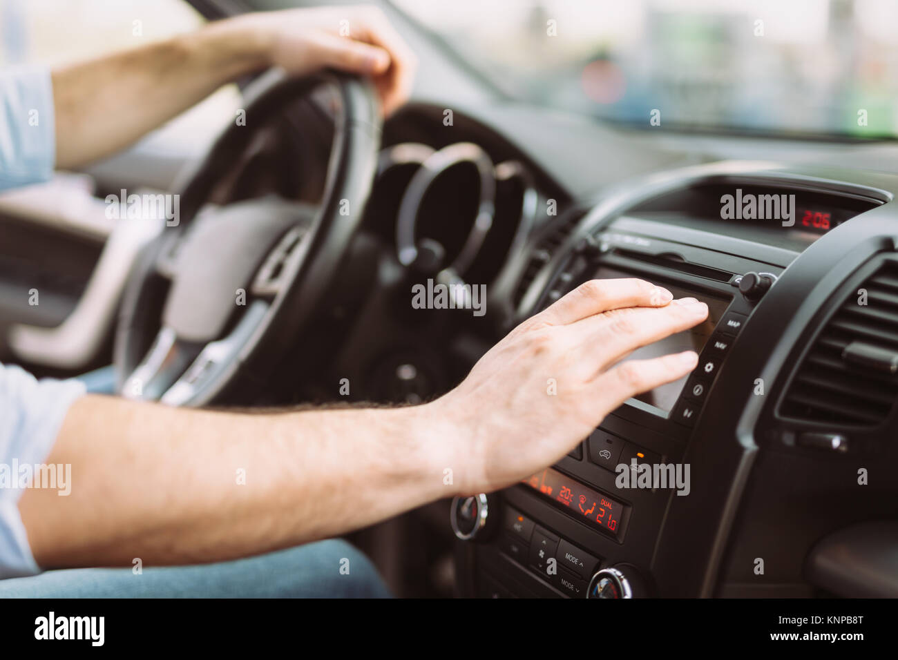Man using navigation system while driving car Stock Photo Alamy