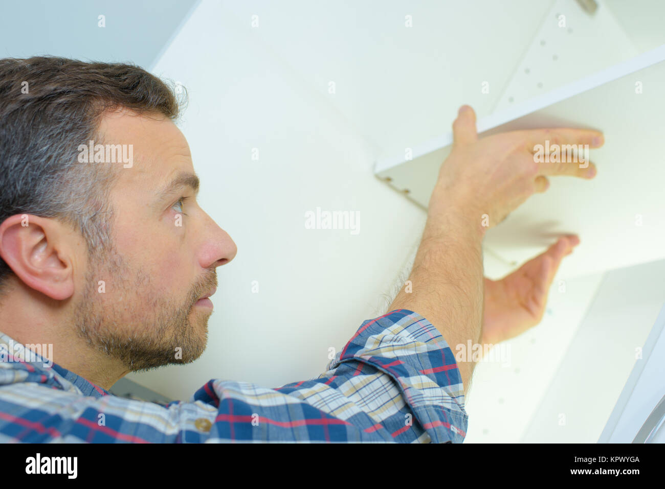 Fitting kitchen storage unit Stock Photo Alamy