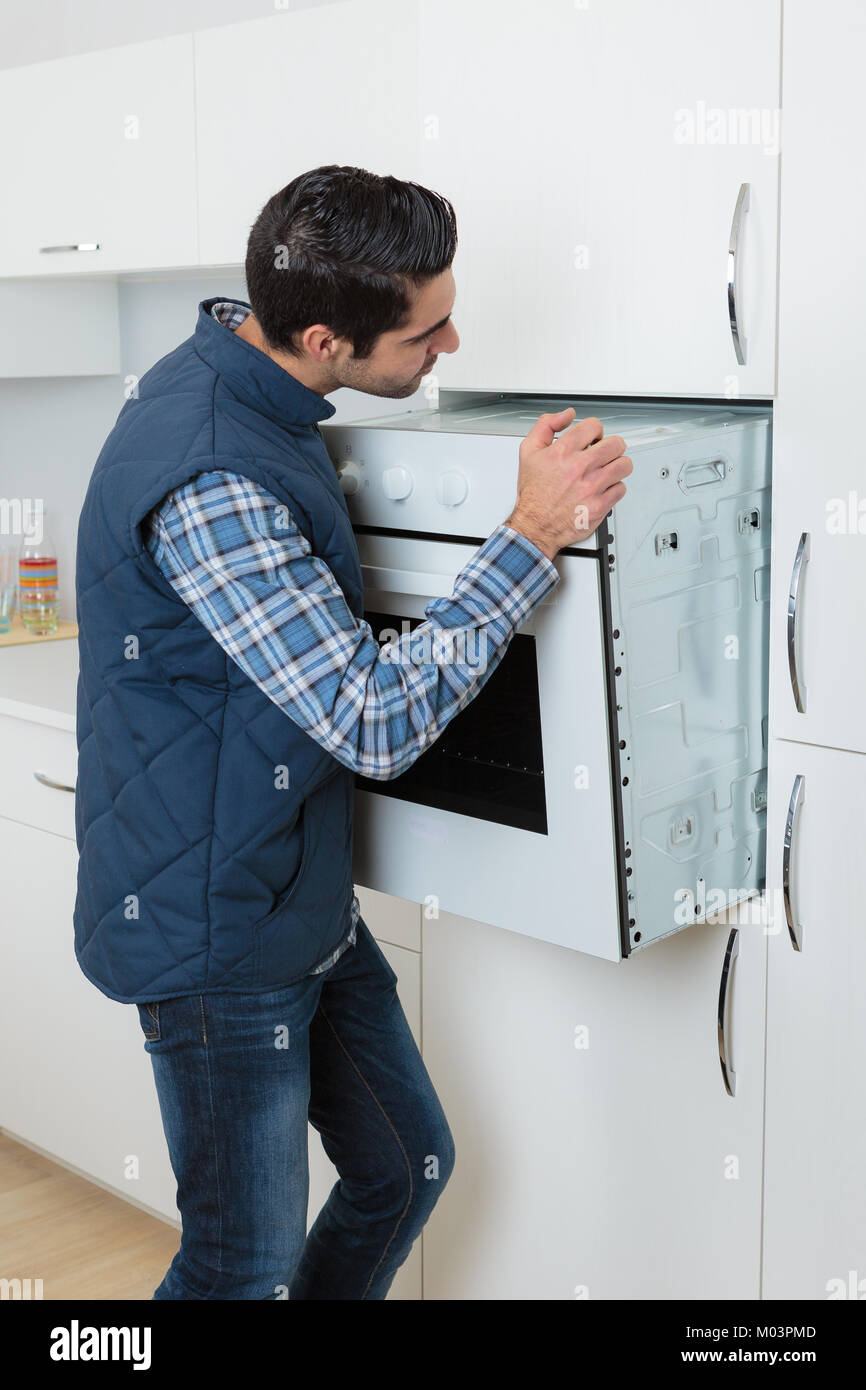 fitting an oven Stock Photo Alamy
