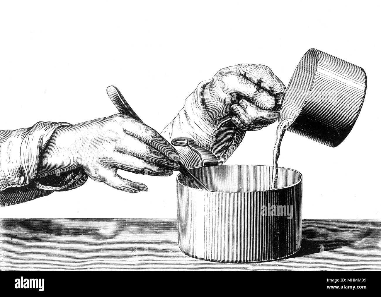 USING TWO SAUCEPANS Stock Photo Alamy