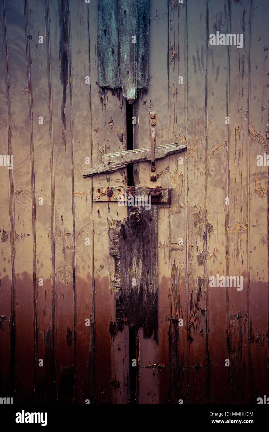 multiple makeshift locks on a lock up Stock Photo Alamy