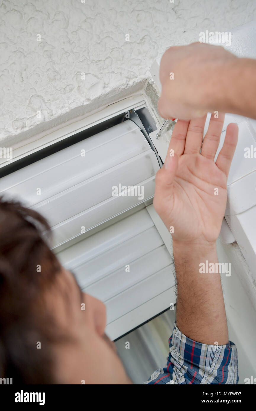 fixing the rolling blinds Stock Photo Alamy