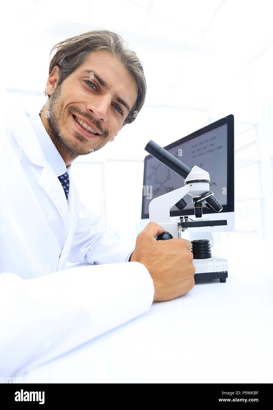 Student in biology using microscope in training class Stock Photo Alamy