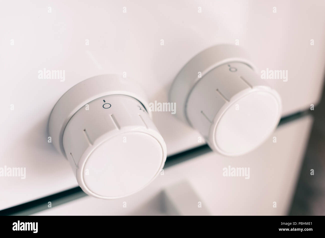 White Oven Control Knobs Stock Photo Alamy