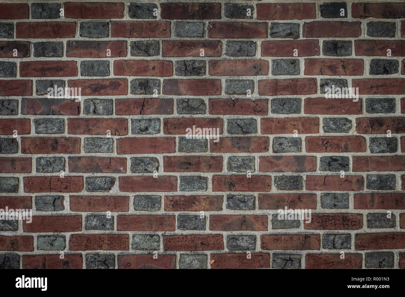 A brick wall background in dramatic style Stock Photo Alamy
