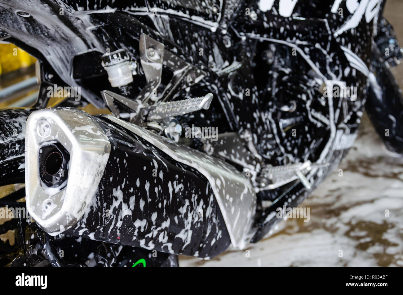 Wash motorcycle with foam Stock Photo Alamy