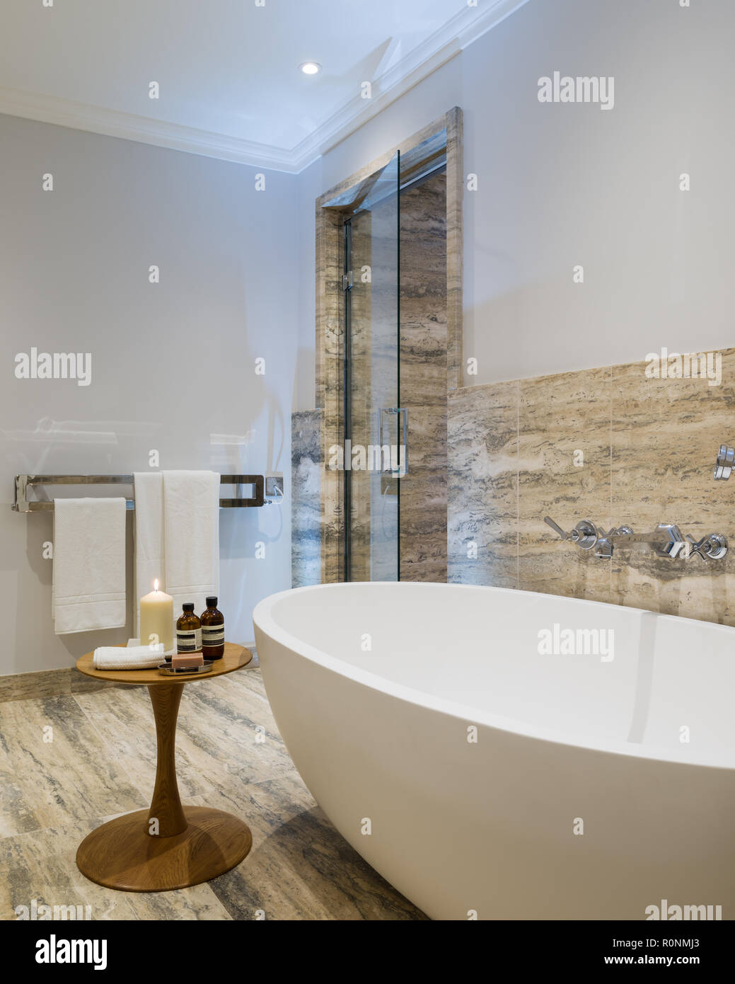 Lit candle by bath Stock Photo Alamy