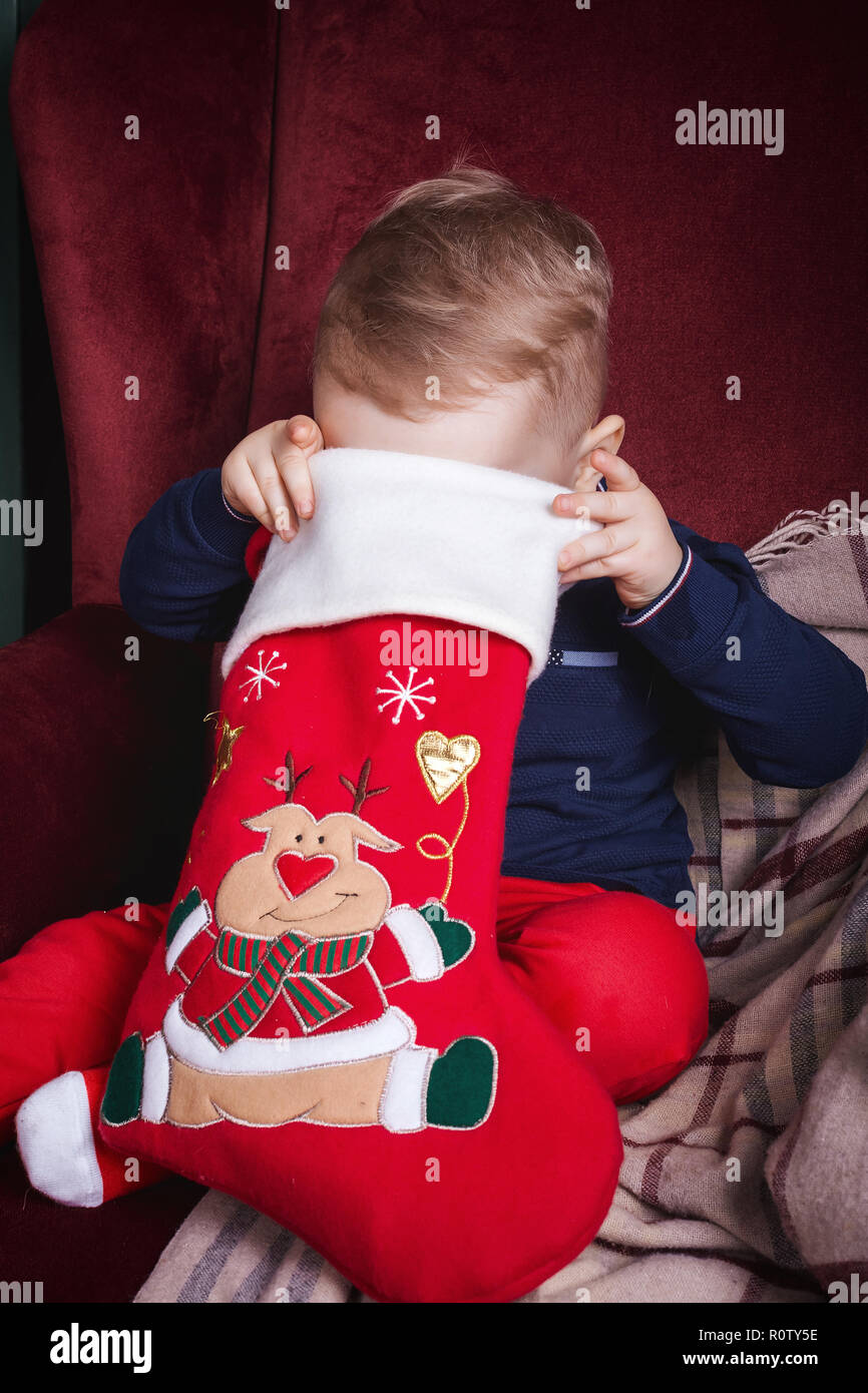 boy looking inside a christmas stocking Stock Photo Alamy