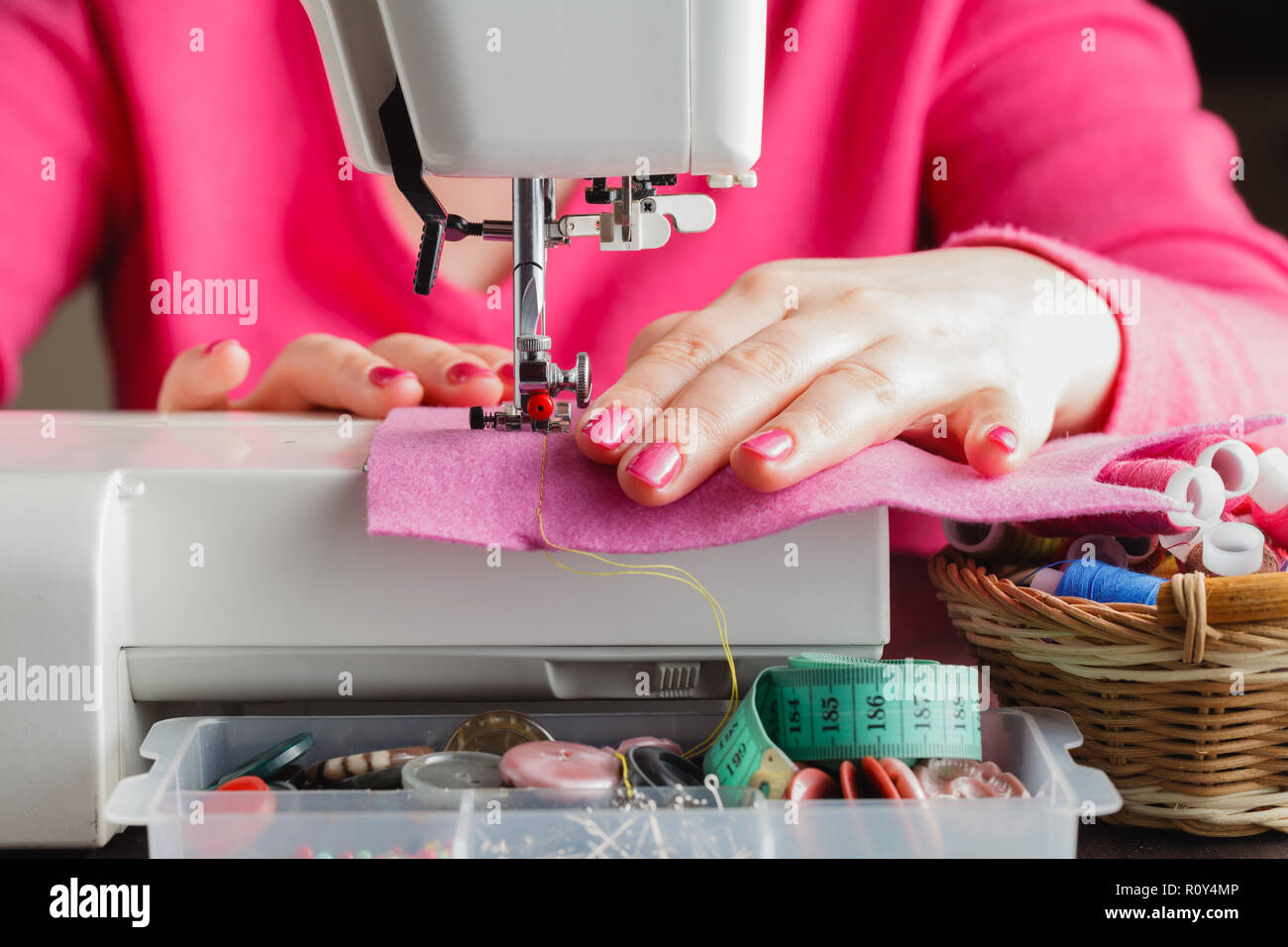 Tailor working on a sewing machine Stock Photo Alamy