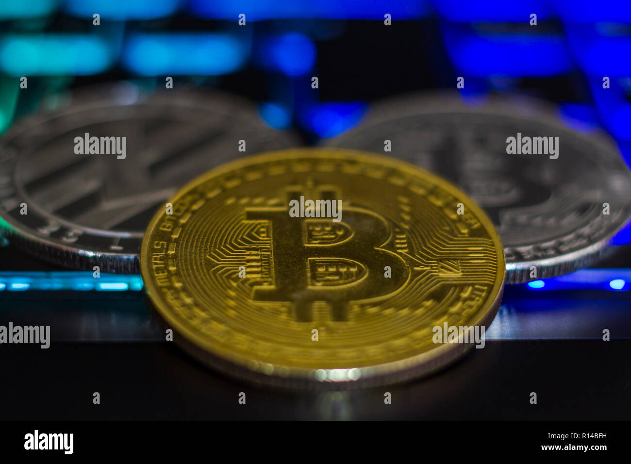 Cryptocurrency coins on computer keyboard Stock Photo - Alamy