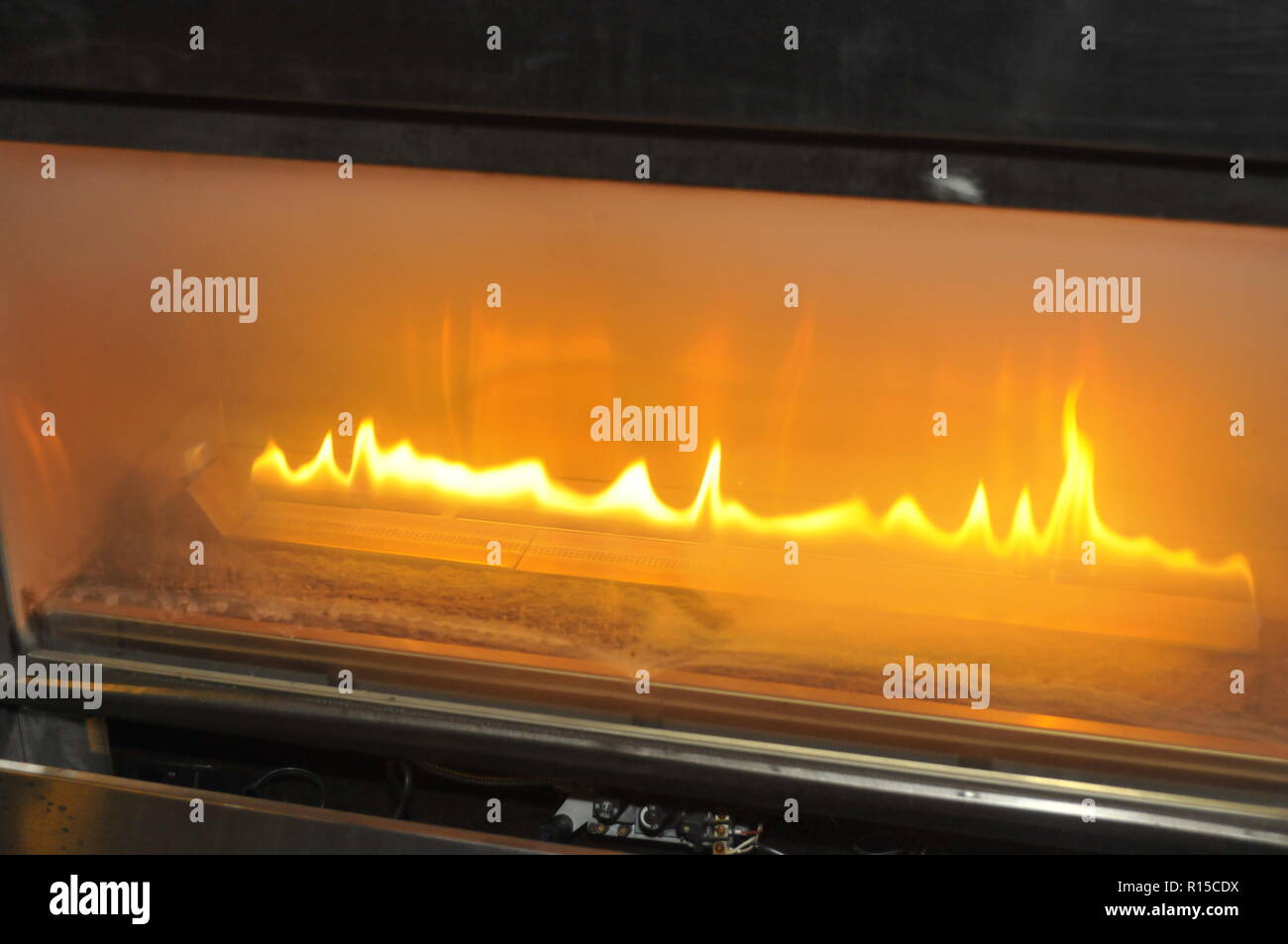Burning gas fire at fireplace Stock Photo Alamy