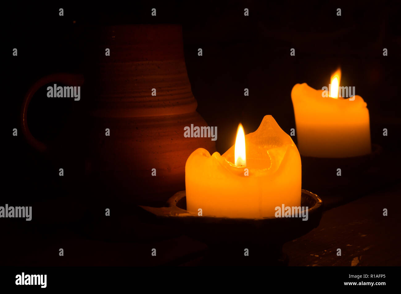 Burning candle in the dark Stock Photo Alamy