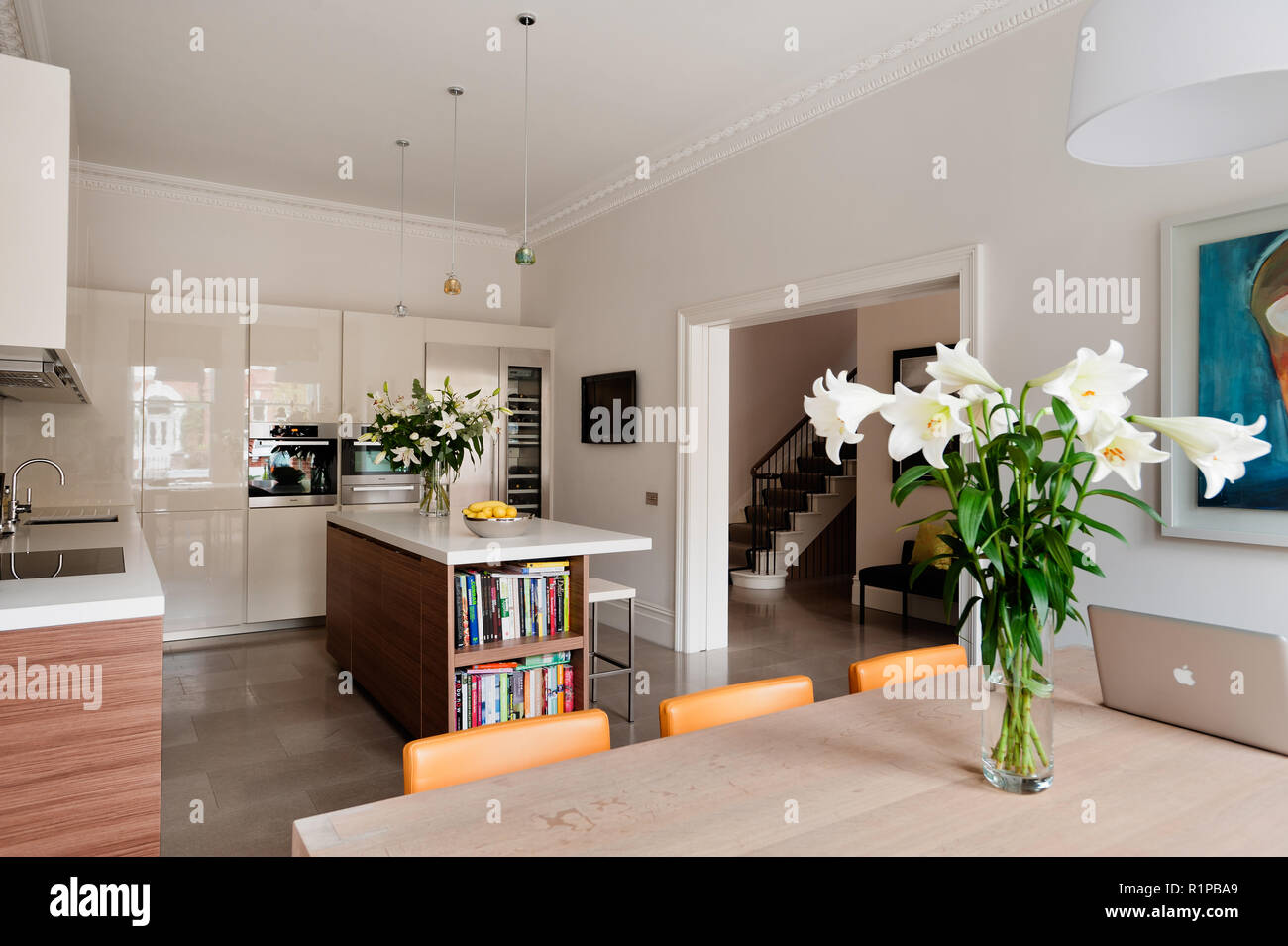 Modern kitchen with flower arrangement Stock Photo Alamy