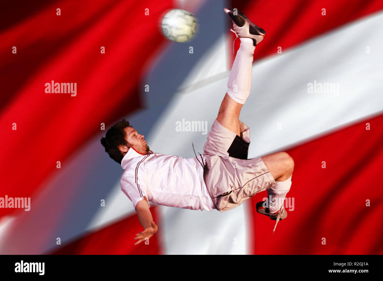 overhead kick before flag Stock Photo Alamy