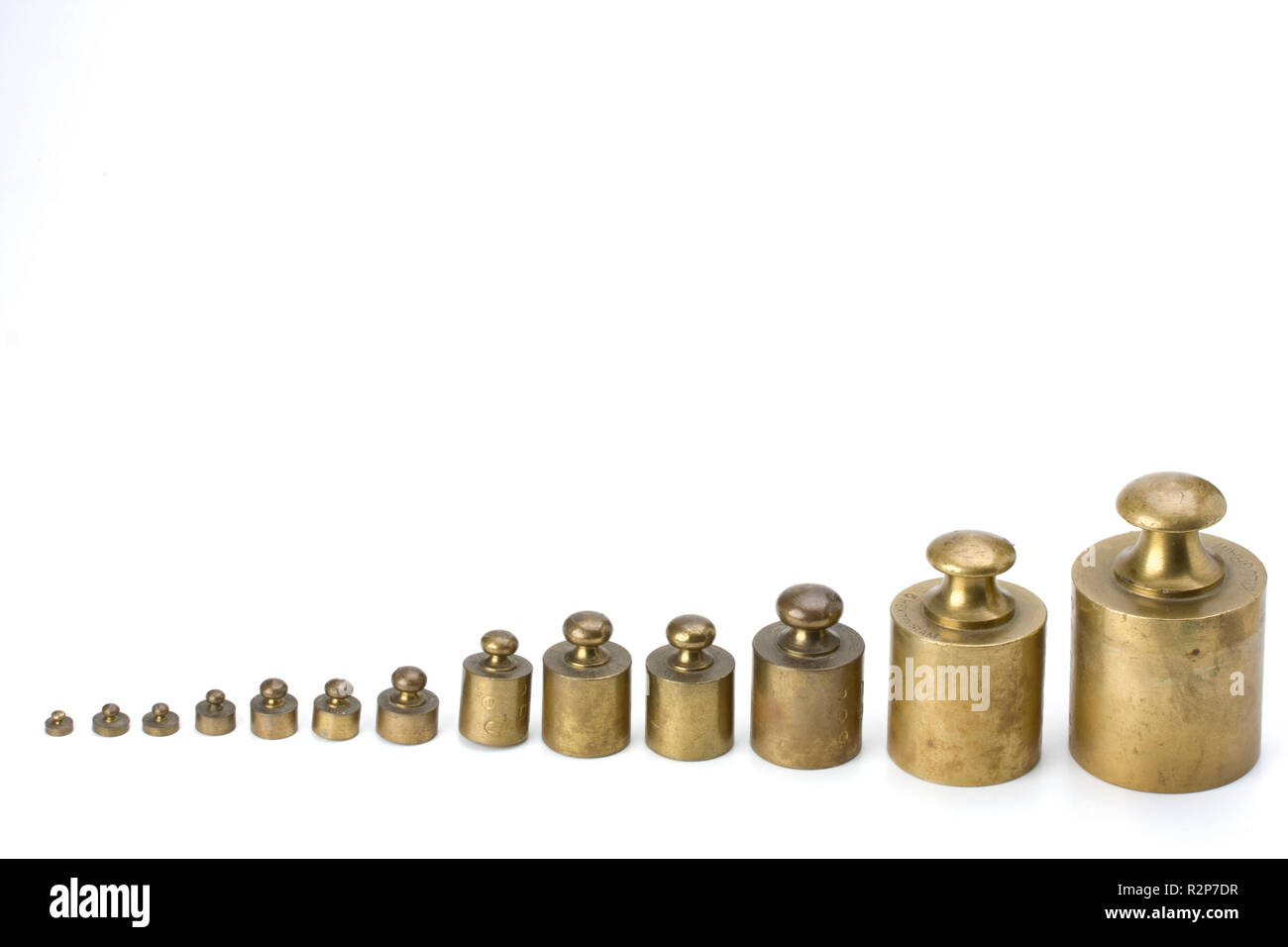 brass weights on white background Stock Photo Alamy