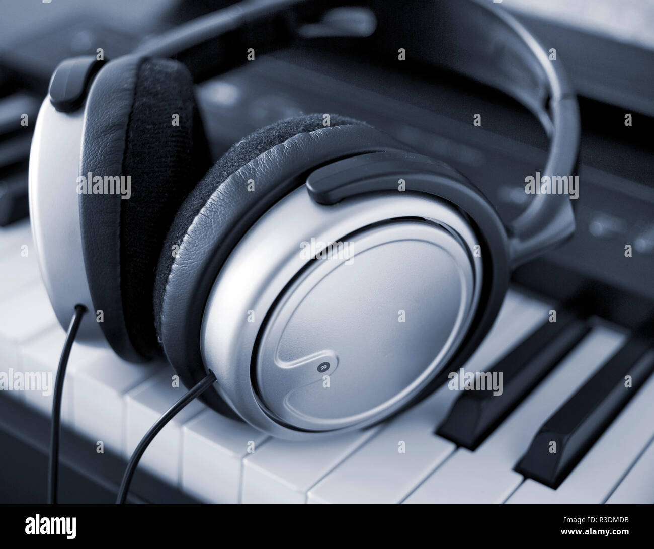headphones on a keyboard Stock Photo - Alamy