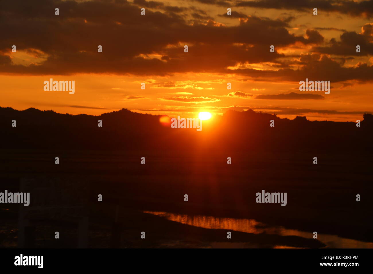 Sun rising at sea beach Stock Photo Alamy