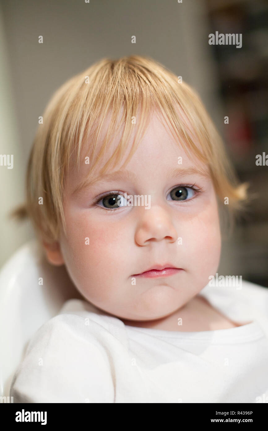 baby face looking seriously Stock Photo Alamy