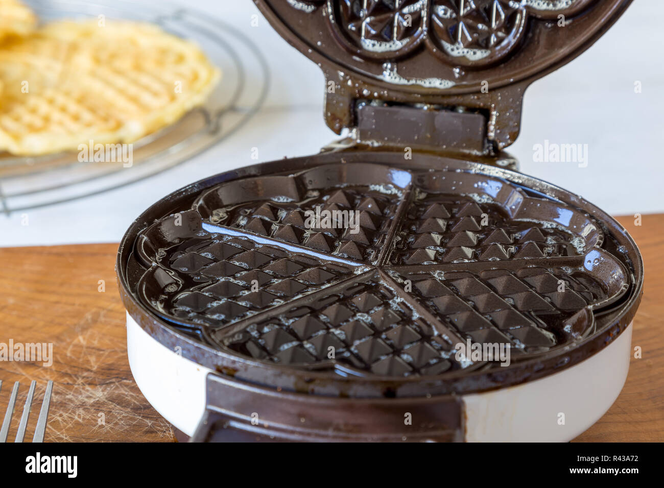 waffle makers in operation Stock Photo Alamy
