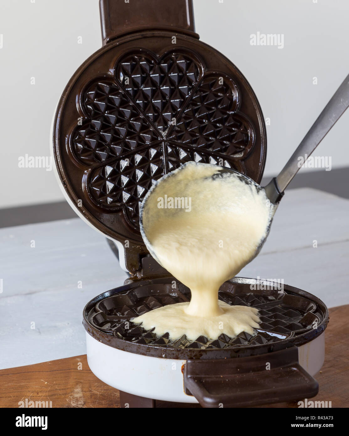 waffle makers in operation Stock Photo Alamy