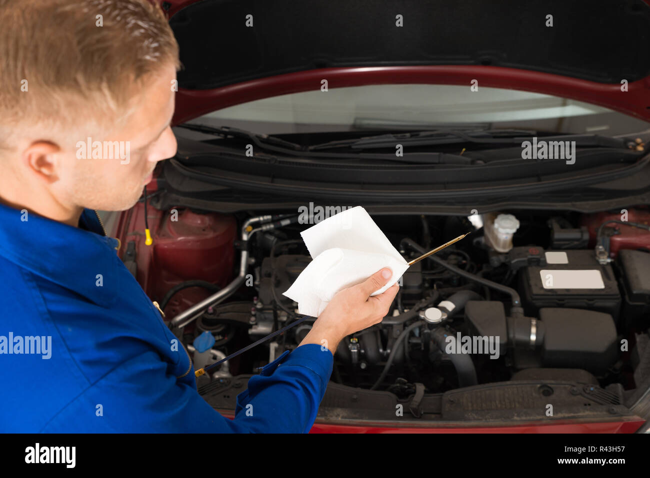 Mechanic Checking Oil Level In Car Engine Stock Photo Alamy