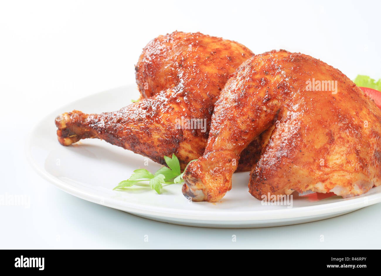 Garlic roasted chicken legs Stock Photo Alamy