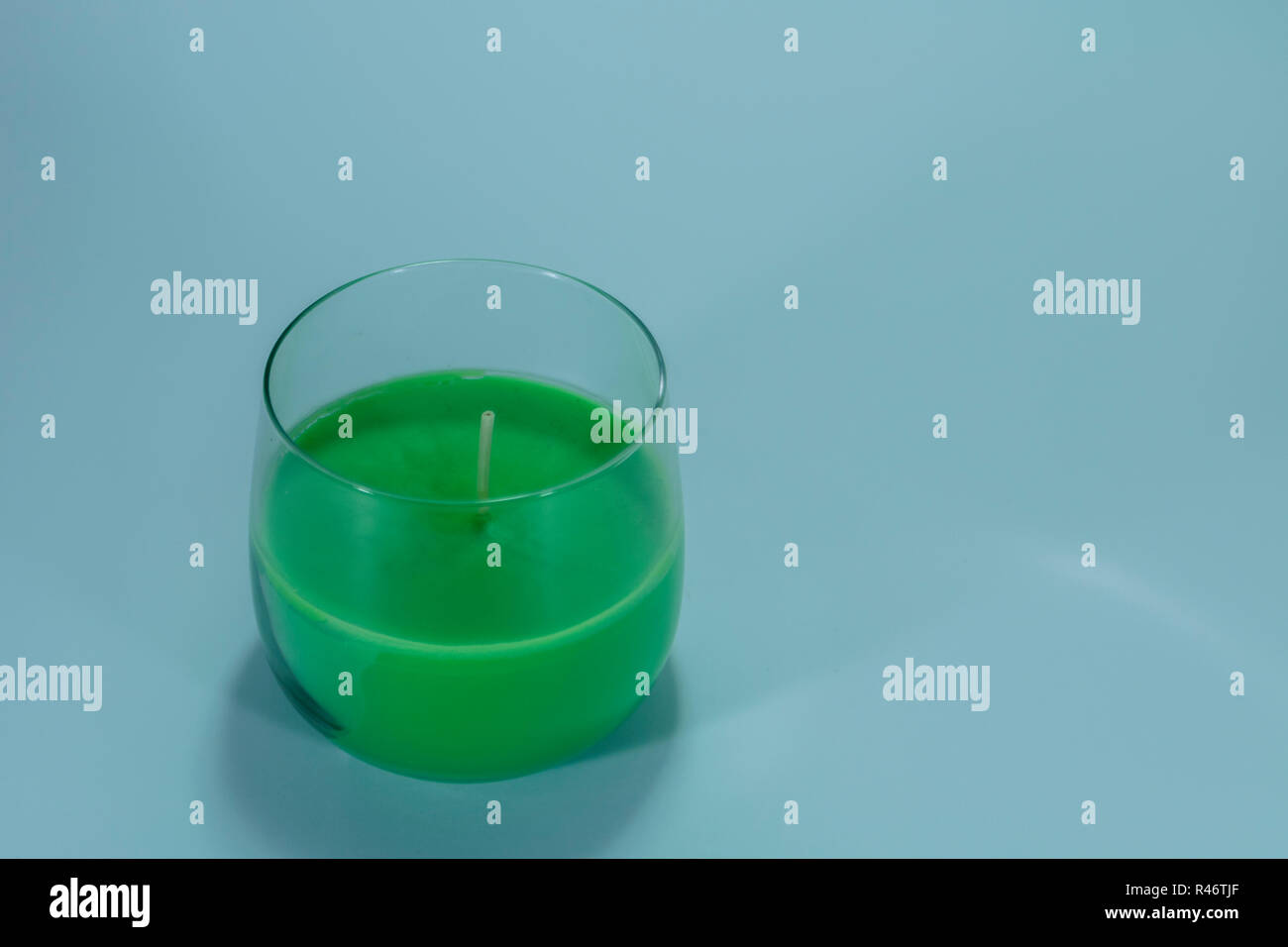Green candle on isolated white background Stock Photo Alamy