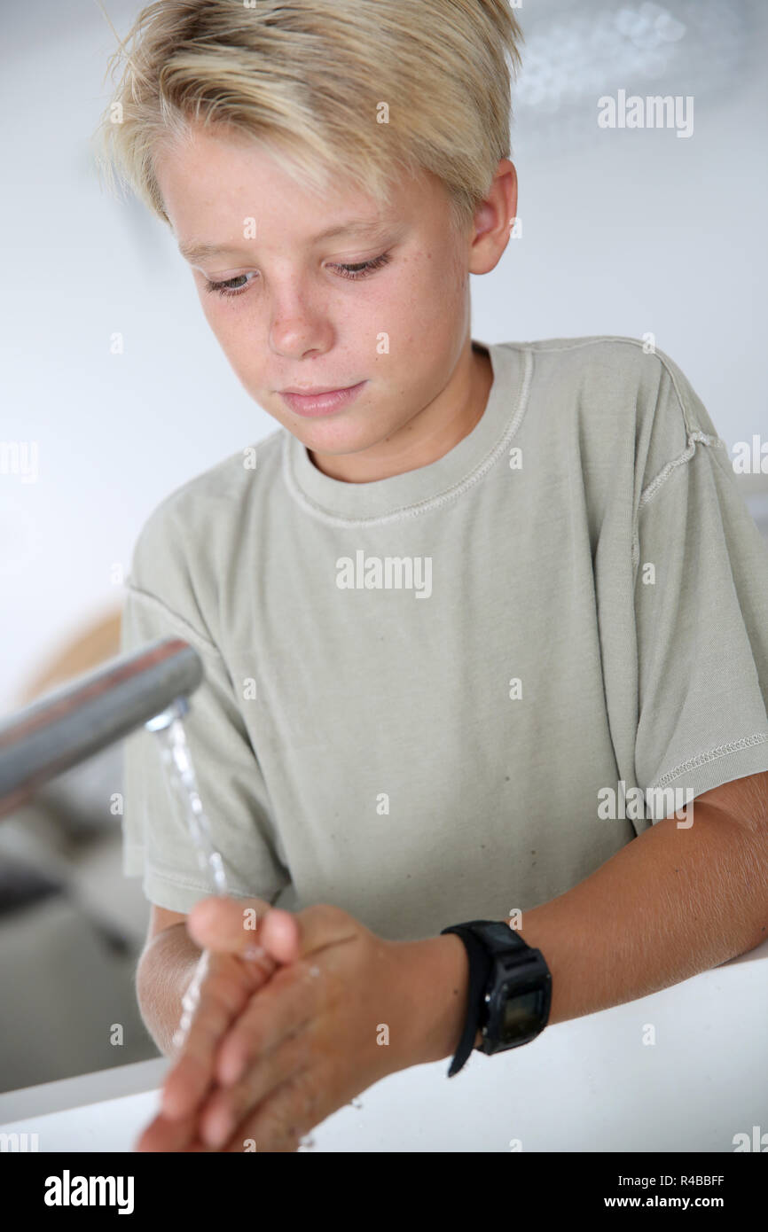 Young boy washing his hands Stock Photo Alamy