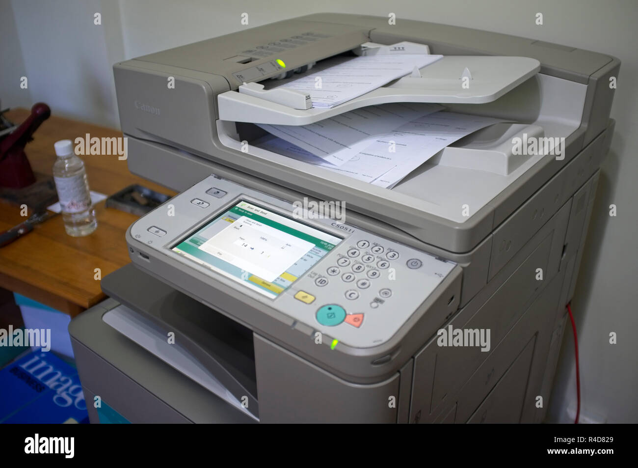 Scanning documents on an office printer/scanner Stock Photo Alamy