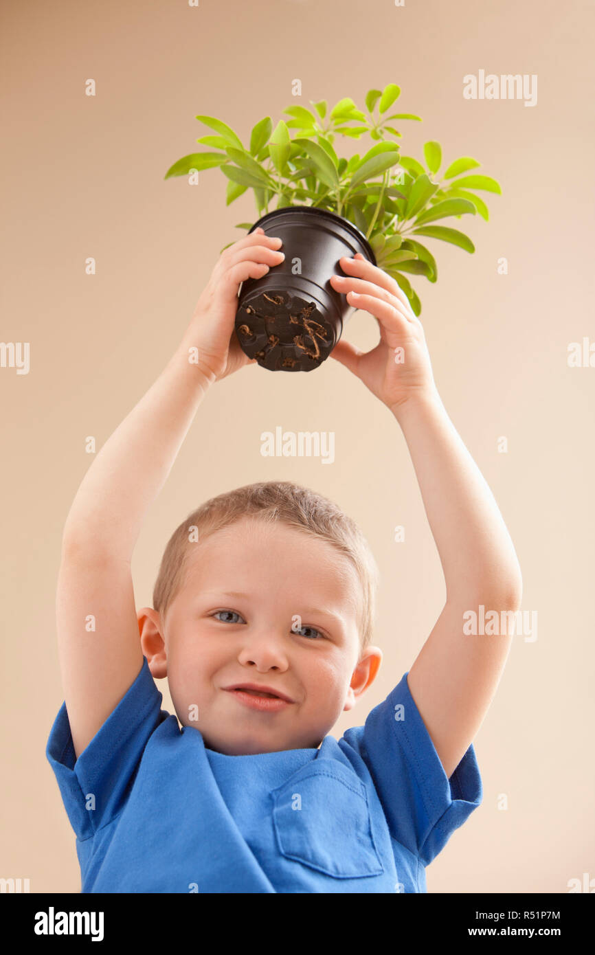 Portrait joyful boy raising arms hires stock photography and images