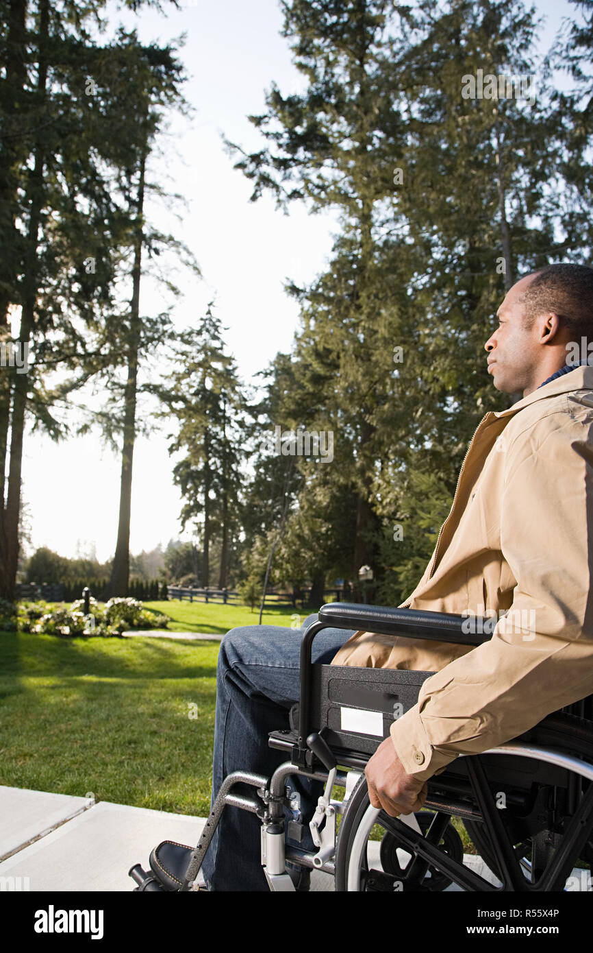 Disabled man using a wheelchair Stock Photo Alamy