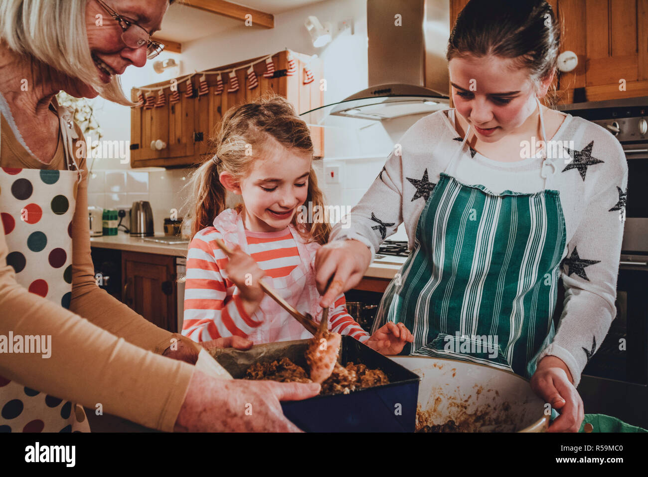 Grandma grandchild baking cake hires stock photography and images Alamy