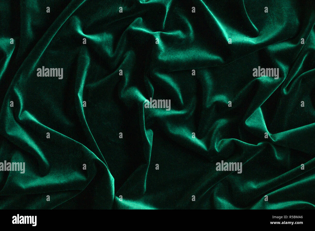 Dark green velvet fabric background hires stock photography and images