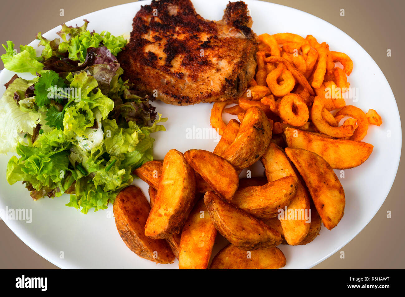 breaded grilled meat,potatoes and vegetables Stock Photo Alamy