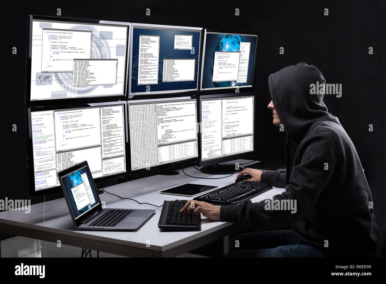 Hacker Using Multiple Computers For Stealing Data Stock Photo Alamy