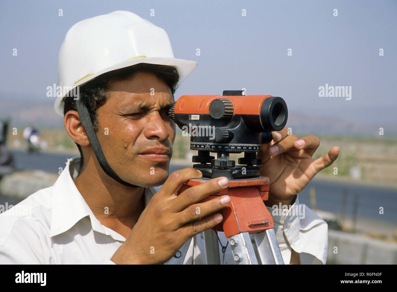 engineer at road construction site, india Stock Photo Alamy