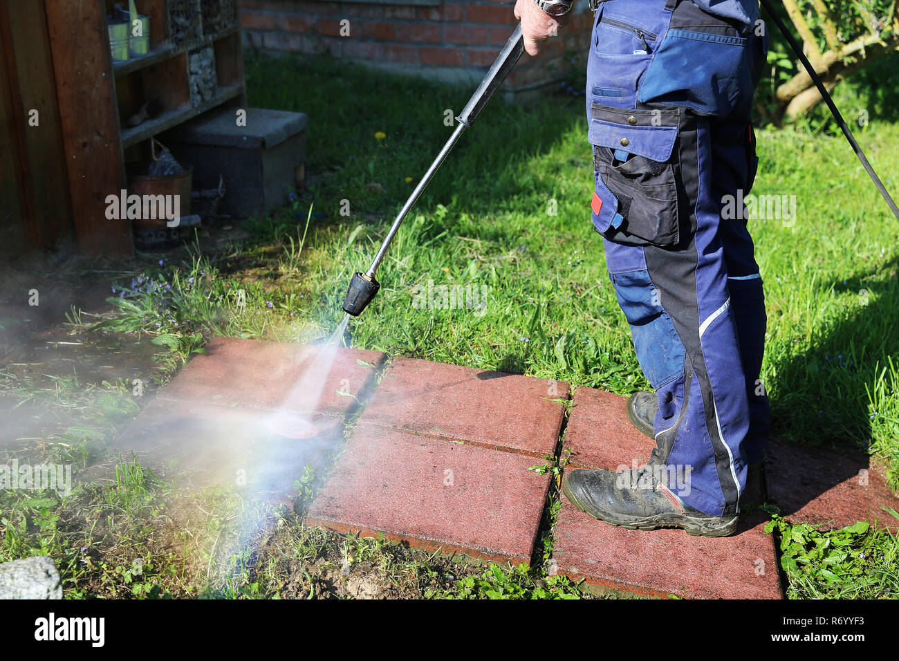 working with the pressure washer Stock Photo Alamy
