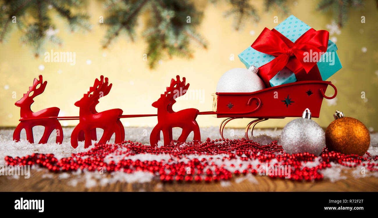 Santa sleigh on gift box background Stock Photo - Alamy