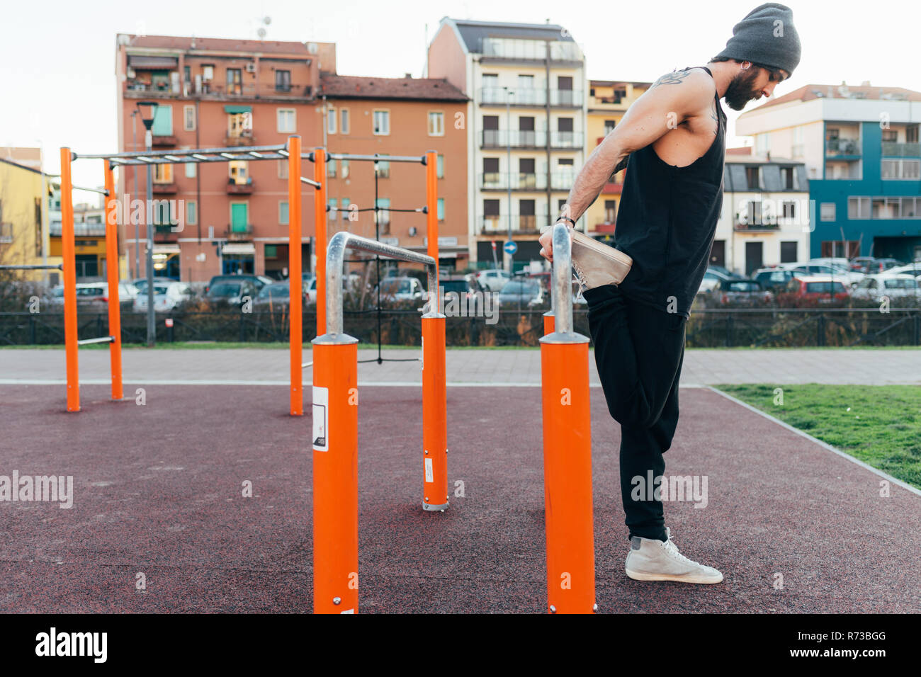 Man using parallel bars in outdoor gym Stock Photo Alamy