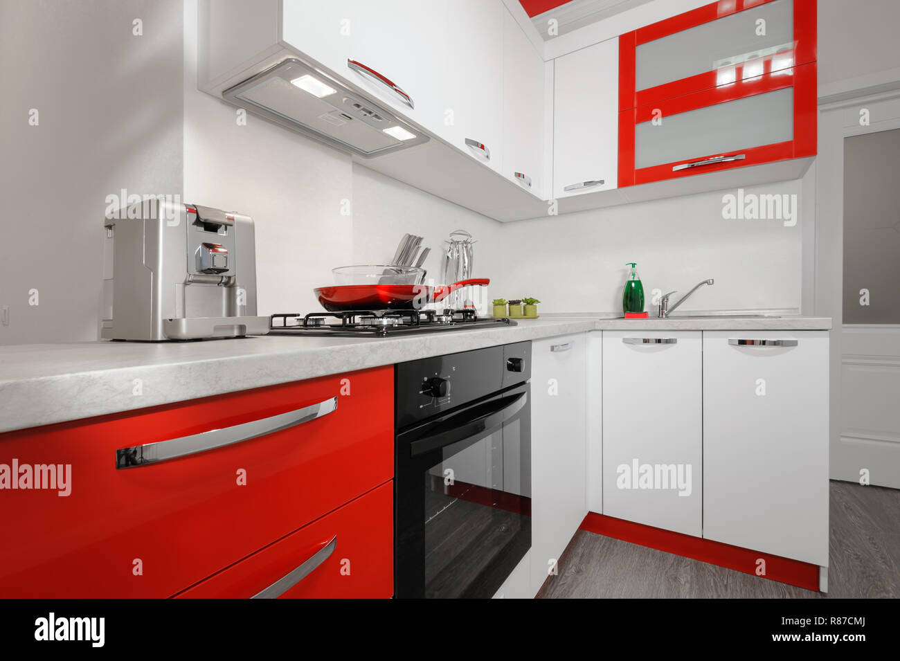 Modern red and white kitchen interior Stock Photo Alamy
