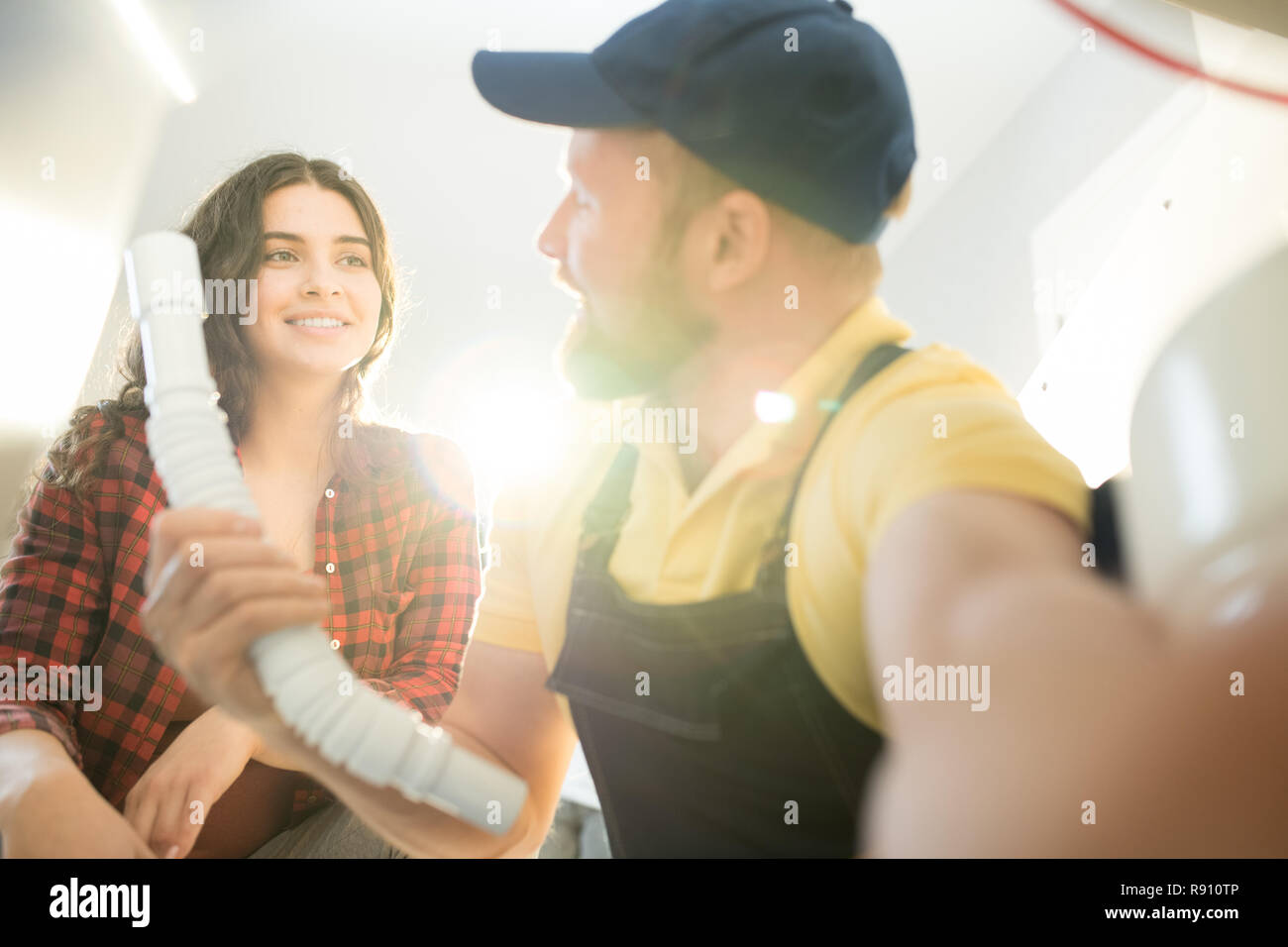 Plumber changing sink pipe Stock Photo Alamy