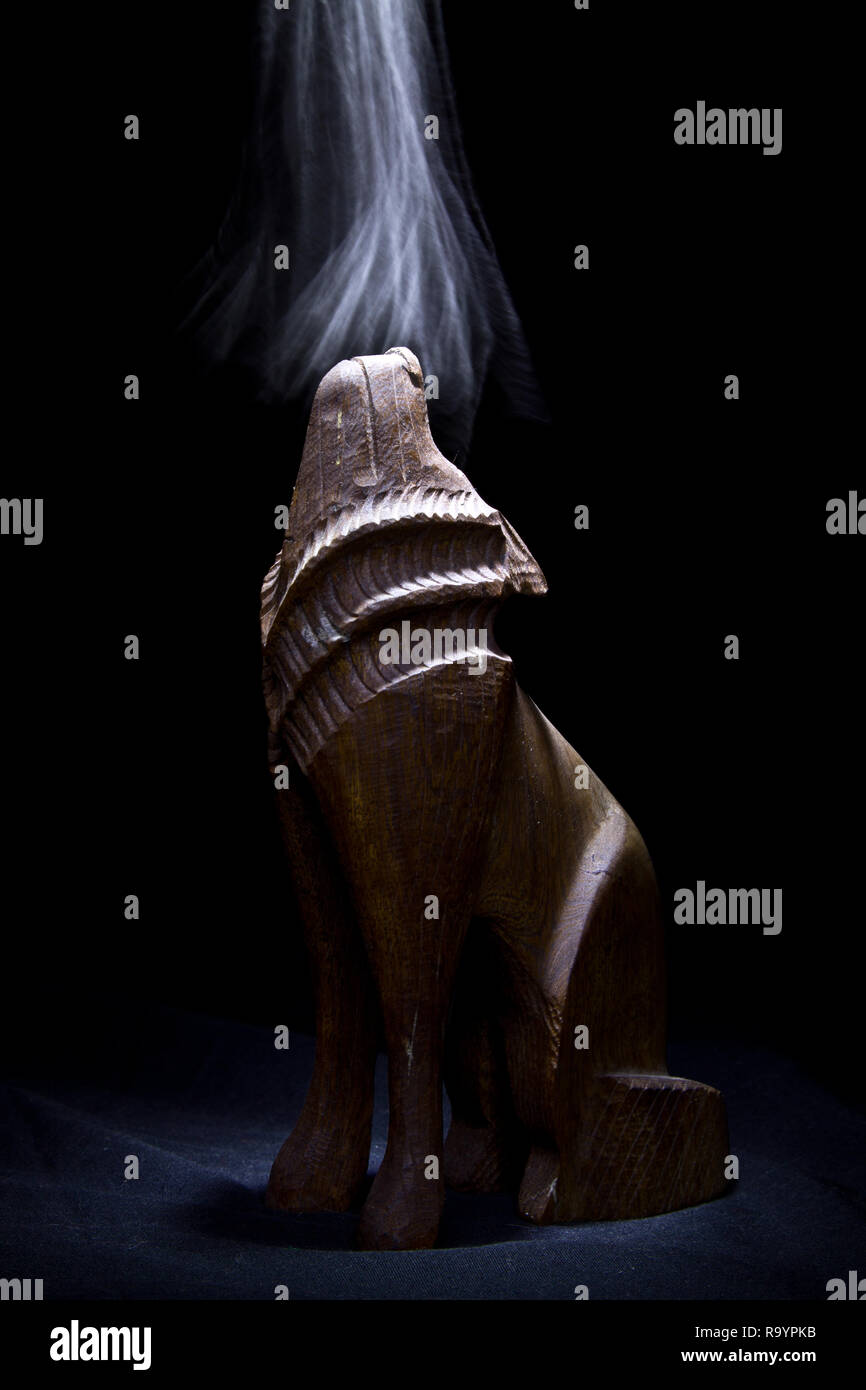 Wooden Wolf Statue with Smoke Stock Photo Alamy