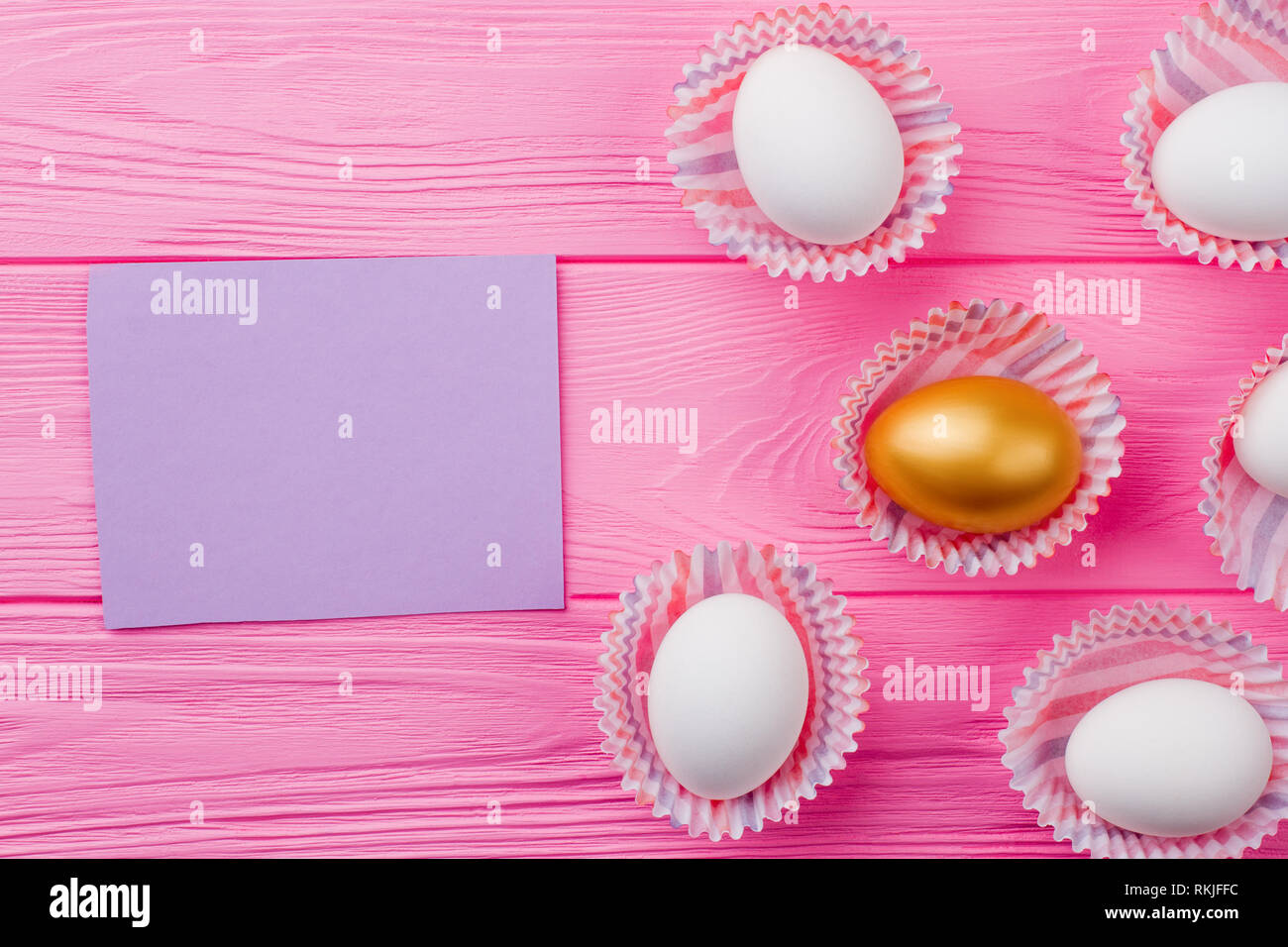 Golden egg among white eggs Stock Photo Alamy